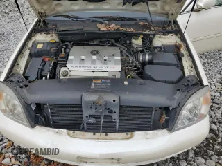 2000 Cadillac DeVille DTS z VIN 1G6KF5797YU263599, wystawiony jako Copart lot #81576484 z przebiegiem 118 414 mil mil oraz Szkoda całkowita • Salvage title. Historia ofert i sprzedaży dostępna na DreamBid. Obrazek 11.