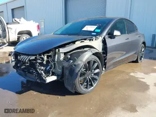 2018 Tesla Model 3 Long Range Battery with VIN 5YJ3E1EA8JF010834, listed as a IAAI auction lot 41598099 with 83,252 mi miles. Bid and sale history available at carsss.com. Image 2.