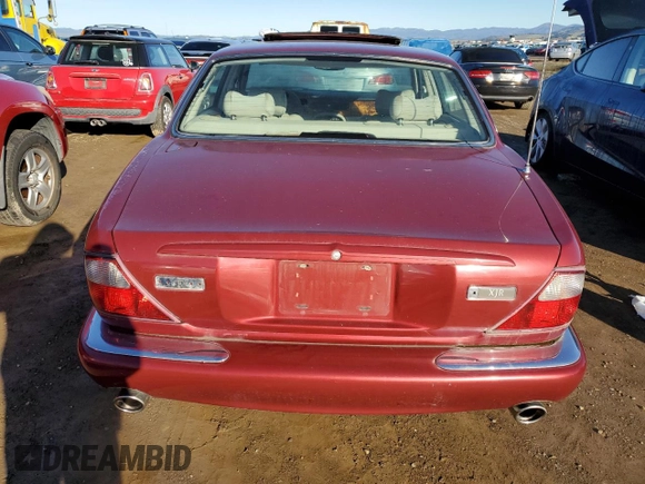1999 Jaguar XJ with VIN SAJPX1849XC857869, listed as a Copart auction lot 83773914 with 172,496 mi miles and Clean title. Bid and sale history available at DreamBid. Image 6.