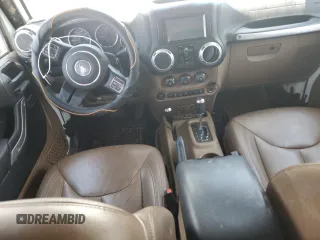 2015 Jeep Wrangler Unlimited Rubicon with VIN 1C4BJWFG6FL710993, listed as a Copart auction lot 62308195 with 103,938 mi miles and Salvage title. Bid and sale history available at DreamBid. Image 8.