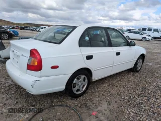 2002 Hyundai Accent GL with VIN KMHCG45C82U358523, listed as a Copart auction lot 48247575 with 164,869 mi miles and Salvage Title. Bid and sale history available at carsss.com. Image 3.