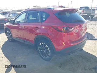 2016 Mazda CX-5 Grand Touring with VIN JM3KE4DY0G0709563, listed as a IAAI auction lot 41886956 with 156,769 mi miles. Bid and sale history available at carsss.com. Image 3.