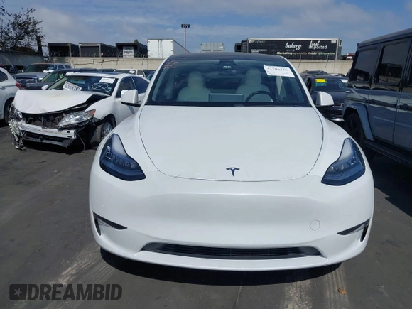 2021 Tesla Model Y Long Range with VIN 5YJYGDEE3MF081304, listed as a IAAI auction lot 41706240 with 90,510 mi miles and . Bid and sale history available at DreamBid. Image 12.