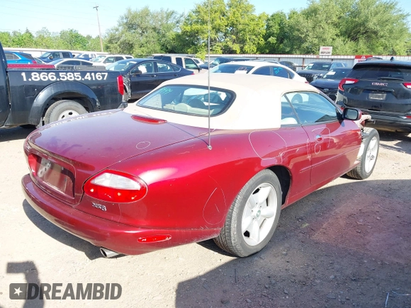 1997 Jaguar XK with VIN SAJGX2748VC011754, listed as a IAAI auction lot 41979459 with 34,601 mi miles and . Bid and sale history available at DreamBid. Image 4.