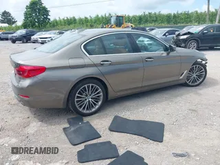 2018 BMW 5 Series 530i xDrive with VIN WBAJA7C55JG909519, listed as a IAAI auction lot 42650263 with 57,077 mi miles and . Bid and sale history available at DreamBid. Image 4.