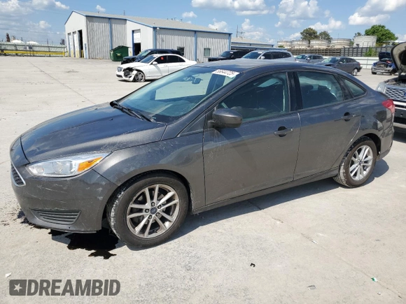 2018 Ford Focus SE with VIN 1FADP3F26JL272212, listed as a Copart auction lot 56644725 with 96,436 mi miles and Salvage title. Bid and sale history available at DreamBid. Image 1.