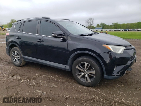 2018 Toyota RAV4 XLE with VIN 2T3WFREV0JW484430, listed as a Copart auction lot 55878455 with 132,335 mi miles and Salvage title. Bid and sale history available at DreamBid. Image 4.