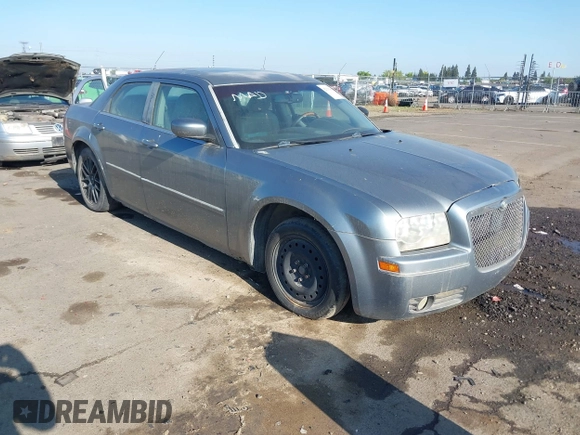 2006 Chrysler 300 Touring with VIN 2C3LA53G66H170047, listed as a IAAI auction lot 42135663 with 215,285 mi miles. Bid and sale history available at carsss.com. Image 1.