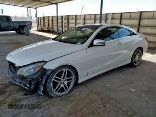 2016 Mercedes-Benz E 400 with VIN WDDKJ6FBXGF322787, listed as a Copart auction lot 61063575 with 124,300 mi miles and Clean title. Bid and sale history available at DreamBid. Image 1.