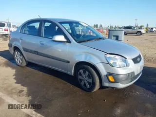 2009 Kia Rio SX with VIN KNADE223296523842, listed as a IAAI auction lot 42024905 with 98,613 mi miles. Bid and sale history available at carsss.com. Image 1.