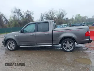 2002 Ford F-150 Harley Davidson with VIN 1FTRW07392KD29874, listed as a IAAI auction lot 41974230 with 163,279 mi miles. Bid and sale history available at carsss.com. Image 14.