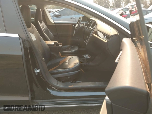 2013 Tesla Model S with VIN 5YJSA1CN3DFP06986, listed as a IAAI auction lot 41271801 with 150,307 mi miles and . Bid and sale history available at DreamBid. Image 5.