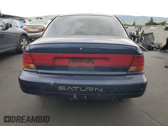 1998 Saturn SL z VIN 1G8ZK5277WZ174641, wystawiony jako Copart lot #54620995 z przebiegiem 109 742 mil mil oraz Szkody całkowita. Historia ofert i sprzedaży dostępna na DreamBid. Obrazek 6.