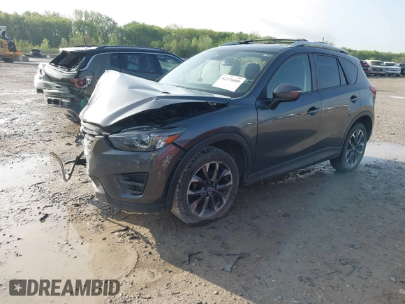 2016 Mazda CX-5 Grand Touring with VIN JM3KE4DYXG0724183, listed as a IAAI auction lot 42176009 with 152,695 mi miles and . Bid and sale history available at DreamBid. Image 2.