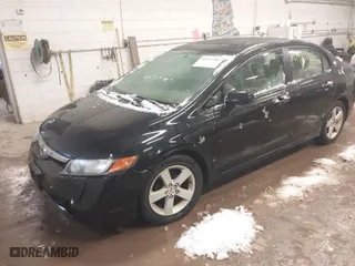 2006 Honda Civic Sdn EX with VIN 1HGFA16806L026147, listed as a IAAI auction lot 41932702 with 215,651 mi miles. Bid and sale history available at carsss.com. Image 2.