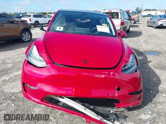 2022 Tesla Model Y Long Range z VIN 7SAYGDEE1NF385414, wystawiony jako IAAI lot #41660542 z przebiegiem 54 075 mil mil oraz . Historia ofert i sprzedaży dostępna na DreamBid. Obrazek 12.