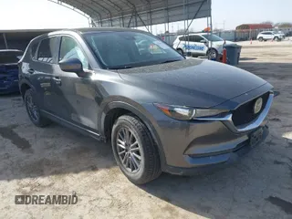 2019 Mazda CX-5 Touring with VIN JM3KFACMXK0686957, listed as a IAAI auction lot 41720338 with 95,421 mi miles. Bid and sale history available at carsss.com. Image 1.
