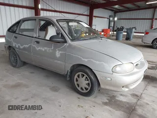 1997 Ford Aspire z VIN KNJLT06H0V6215753, wystawiony jako IAAI lot #41504661 z przebiegiem 80 300 mil mil oraz . Historia ofert i sprzedaży dostępna na DreamBid. Obrazek 1.