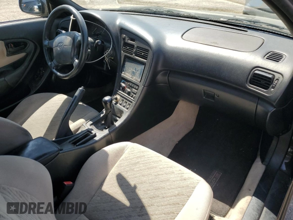 1997 Toyota Celica GT z VIN JT5FG02TXV0044202, wystawiony jako Copart lot #52166575 z przebiegiem 167 292 mil mil oraz Szkoda całkowita • Salvage title. Historia ofert i sprzedaży dostępna na DreamBid. Obrazek 8.