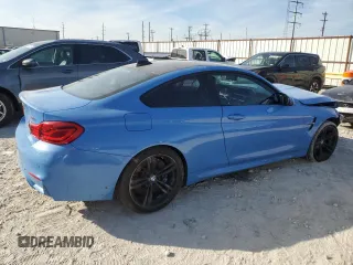 2018 BMW M4 with VIN WBS4Y9C51JAC87281, listed as a Copart auction lot 40663874 with 53,003 mi miles. Bid and sale history available at carsss.com. Image 3.