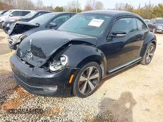 2012 Volkswagen Beetle 2.0T Turbo w/Sun/Snd/Nav PZEV with VIN 3VWVA7AT4CM655068, listed as a IAAI auction lot 41605197 with 115,546 mi miles. Bid and sale history available at carsss.com. Image 2.