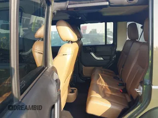 2015 Jeep Wrangler Unlimited Altitude с VIN 1C4HJWEG7FL584395, выставлен на аукционе IAAI как лот 42399987 с пробегом 142 906 миль миль и . История ставок и продаж доступна на DreamBid. Изображение 8.