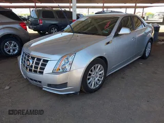 2013 Cadillac CTS Luxury with VIN 1G6DE5E52D0156666, listed as a IAAI auction lot 42058687 with 120,659 mi miles and . Bid and sale history available at DreamBid. Image 2.