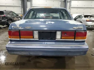 1991 Dodge Spirit z VIN 1B3XA46K9MF628235, wystawiony jako Copart lot #83581274 z przebiegiem 117 774 mil mil oraz Szkody całkowita. Historia ofert i sprzedaży dostępna na DreamBid. Obrazek 6.
