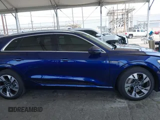 2021 Audi e-tron Premium Plus with VIN WA1LAAGE4MB038563, listed as a IAAI auction lot 42422063 with 31,645 mi miles and . Bid and sale history available at DreamBid. Image 14.