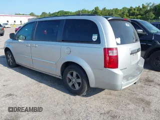 2009 Dodge Grand Caravan SXT z VIN 2D8HN54189R671683, wystawiony jako IAAI lot #42350455 z przebiegiem 220 306 mil mil oraz . Historia ofert i sprzedaży dostępna na DreamBid. Obrazek 3.