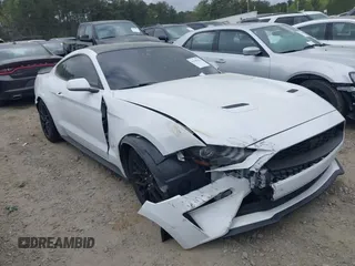 2022 Ford Mustang EcoBoost with VIN 1FA6P8TH7N5100487, listed as a IAAI auction lot 41948342 with 58,802 mi miles and . Bid and sale history available at DreamBid. Image 1.