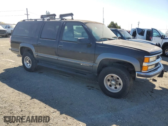 1999 Chevrolet Suburban with VIN 1GNGK26R5XJ513945, listed as a Copart auction lot 73673314 with 198,656 mi miles and Clean Title. Bid and sale history available at carsss.com. Image 4.