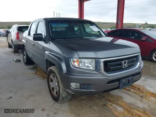 2009 Honda Ridgeline RT with VIN 2HJYK16279H501015, listed as a IAAI auction lot 41996301 with 124,716 mi miles. Bid and sale history available at carsss.com. Image 1.