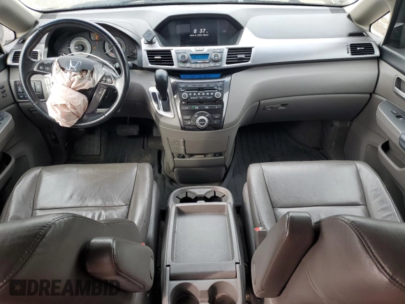 2012 Honda Odyssey Touring with VIN 5FNRL5H94CB109257, listed as a Copart auction lot 59636075 with 107,543 mi miles and Salvage title. Bid and sale history available at DreamBid. Image 8.