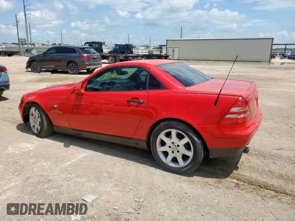 2000 Mercedes-Benz SLK 230 Kompressor with VIN WDBKK47F2YF156715, listed as a Copart auction lot 63873805 with 140,706 mi miles and Salvage title. Bid and sale history available at DreamBid. Image 2.