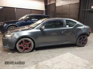 2012 Scion tC with VIN JTKJF5C7XC3034998, listed as a IAAI auction lot 41591632 with 171,121 mi miles. Bid and sale history available at carsss.com. Image 14.