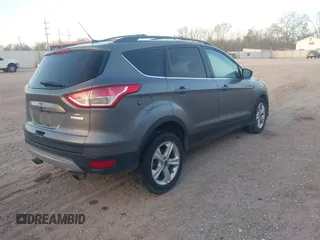 2014 Ford Escape SE with VIN 1FMCU0G91EUB05180, listed as a IAAI auction lot 41758185 with 186,042 mi miles. Bid and sale history available at carsss.com. Image 4.
