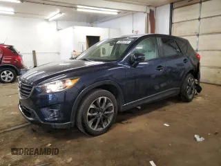 2016 Mazda CX-5 Grand Touring z VIN JM3KE4DY0G0827371, wystawiony jako Copart lot #58997215 z przebiegiem 79 620 mil mil oraz Szkoda całkowita • Salvage title. Historia ofert i sprzedaży dostępna na DreamBid. Obrazek 1.