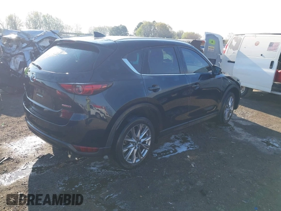 2020 Mazda CX-5 Grand Touring with VIN JM3KFBDM0L0790508, listed as a IAAI auction lot 41883319 with 114,398 mi miles and . Bid and sale history available at carsss.com. Image 4.