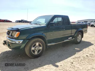 2000 Nissan Frontier XE with VIN 1N6ED26T0YC402826, listed as a Copart auction lot 50810195 with 311,577 mi miles and Salvage title. Bid and sale history available at DreamBid. Image 1.