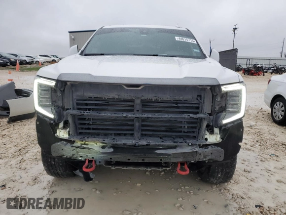 2021 GMC Yukon AT4 with VIN 1GKS2CKD1MR287374, listed as a Copart auction lot 44615715 with 57,552 mi miles and Salvage Title. Bid and sale history available at carsss.com. Image 5.