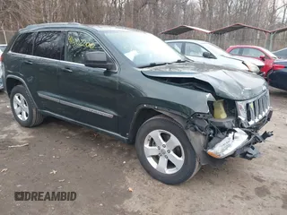 2011 Jeep Grand Cherokee Laredo z VIN 1J4RR4GG0BC703276, wystawiony jako IAAI lot #41502200 z przebiegiem 179 296 mil mil oraz . Historia ofert i sprzedaży dostępna na DreamBid. Obrazek 1.