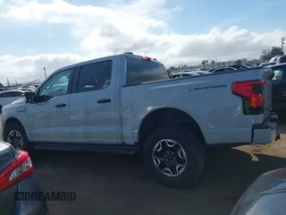 2023 Ford F-150 Lightning Pro z VIN 1FTVW1EL6PWG01336, wystawiony jako IAAI lot #41692903 z przebiegiem 39 085 mil mil oraz . Historia ofert i sprzedaży dostępna na DreamBid. Obrazek 14.