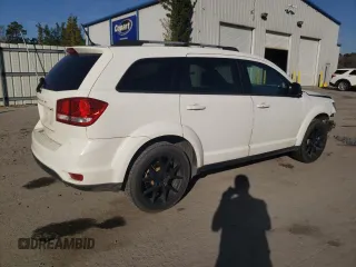 2017 Dodge Journey SXT with VIN 3C4PDCBB1HT569229, listed as a Copart auction lot 46286195 with 112,572 mi miles and Salvage Title. Bid and sale history available at DreamBid. Image 3.
