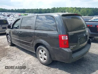 2010 Dodge Grand Caravan SE with VIN 2D4RN4DE2AR339889, listed as a IAAI auction lot 40034624 with 104,896 mi miles and . Bid and sale history available at DreamBid. Image 3.