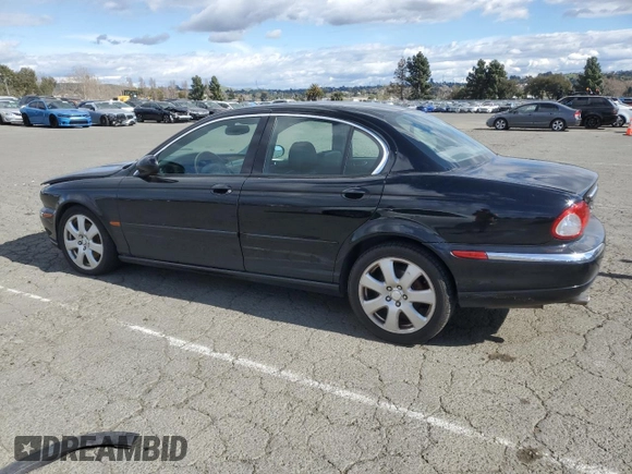 2004 Jaguar X-Type with VIN SAJEA51C74WD56736, listed as a Copart auction lot 48038295 with 115,817 mi miles and Salvage Title. Bid and sale history available at DreamBid. Image 2.