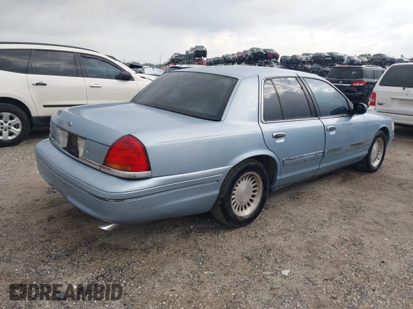 1999 Ford Crown Victoria z VIN 2FAFP73WXXX221069, wystawiony jako IAAI lot #41750127 z przebiegiem 177 142 mil mil oraz . Historia ofert i sprzedaży dostępna na DreamBid. Obrazek 4.