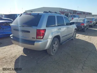 2007 Jeep Grand Cherokee Laredo with VIN 1J8HS48P77C595484, listed as a IAAI auction lot 41775290 with 176,751 mi miles. Bid and sale history available at carsss.com. Image 4.