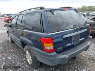 2003 Jeep Grand Cherokee Laredo with VIN 1J4GW48S63C591605, listed as a IAAI auction lot 41973681 with 177,024 mi miles. Bid and sale history available at carsss.com. Image 3.