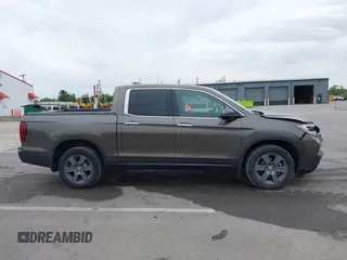 2020 Honda Ridgeline RTL-E with VIN 5FPYK3F78LB001882, listed as a IAAI auction lot 42352980 with 63,278 mi miles and . Bid and sale history available at DreamBid. Image 14.